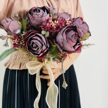 A bouquet of roses, with a burnt and vintage oil painting aesthetic, artificial flowers